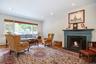 Large living room with wood-burning fireplace.