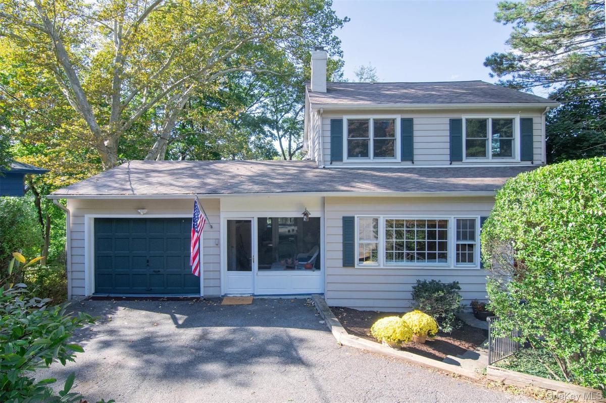 One car garage and sun room entrance.