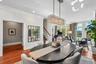 Santos Mahogany floors and crown molding  run throughout the open concept layout
