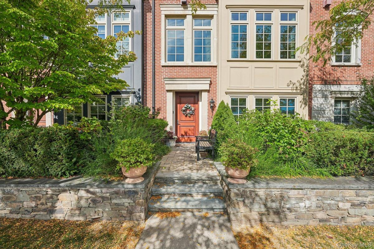 Brownstone entrance with exteriors designed after historic NYC brownstones