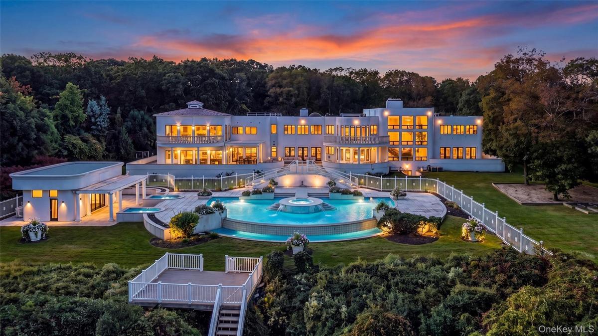 Estate aerial at twilight (virtually enhanced twilight/night rendering)