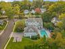 Aerial view from back of structure featuring the expansive backyard and pool area