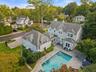 Aerial view of side/back structure showcases the expansive size and breadth of the home
