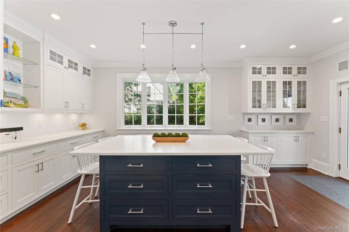 Charming kitchen eat-in area, complete with additional cabinetry and counter space, offers the perfect setting for casual dining