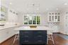 Charming kitchen eat-in area, complete with additional cabinetry and counter space, offers the perfect setting for casual dining