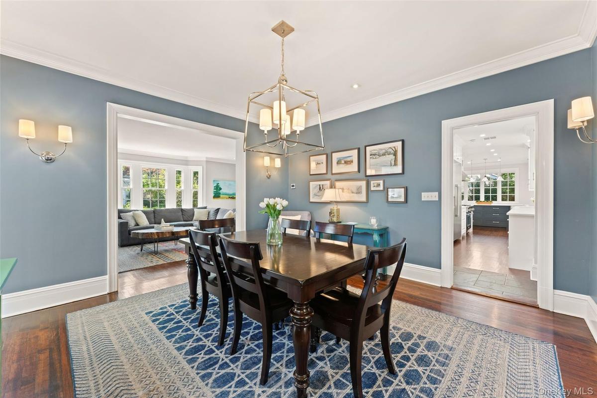View of the dining room flow between the living room and kitchen for easy guest entertainment