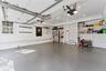 Two-car garage with shelving and storage space for organization