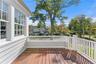 Primary bedroom has access to deck area for outdoor relaxation
