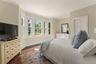 Generous first-floor ensuite bedroom with full bath offers flexibility for guests