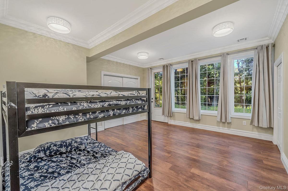 Bdrm One - Ground level bedroom/office with closets and seprate exterior entry