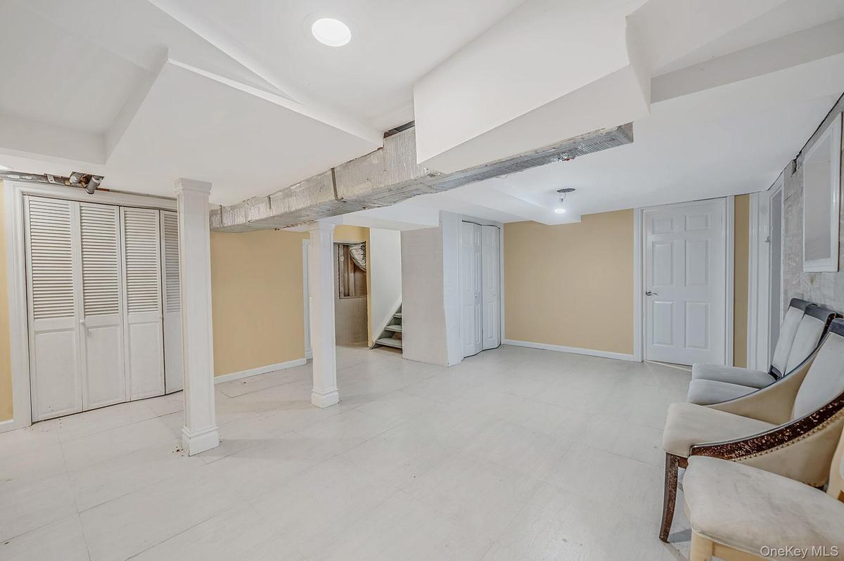 Was maid's quarter - Outisde entrance, potential for summer kitchen, adiditonal rec space, access to utiltities and laundry room