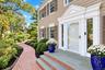 Welcoming Front Entrance With Brick Walkway & Bluestone Steps