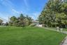 View of front of house with a front lawn and driveway