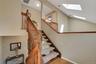 New carpeted staircase, and wood-finish flooring