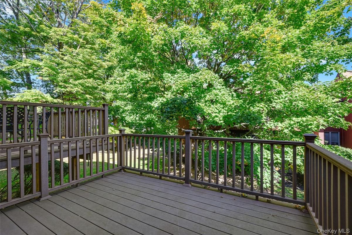 Expansive outdoor deck with composite decking and full railing
