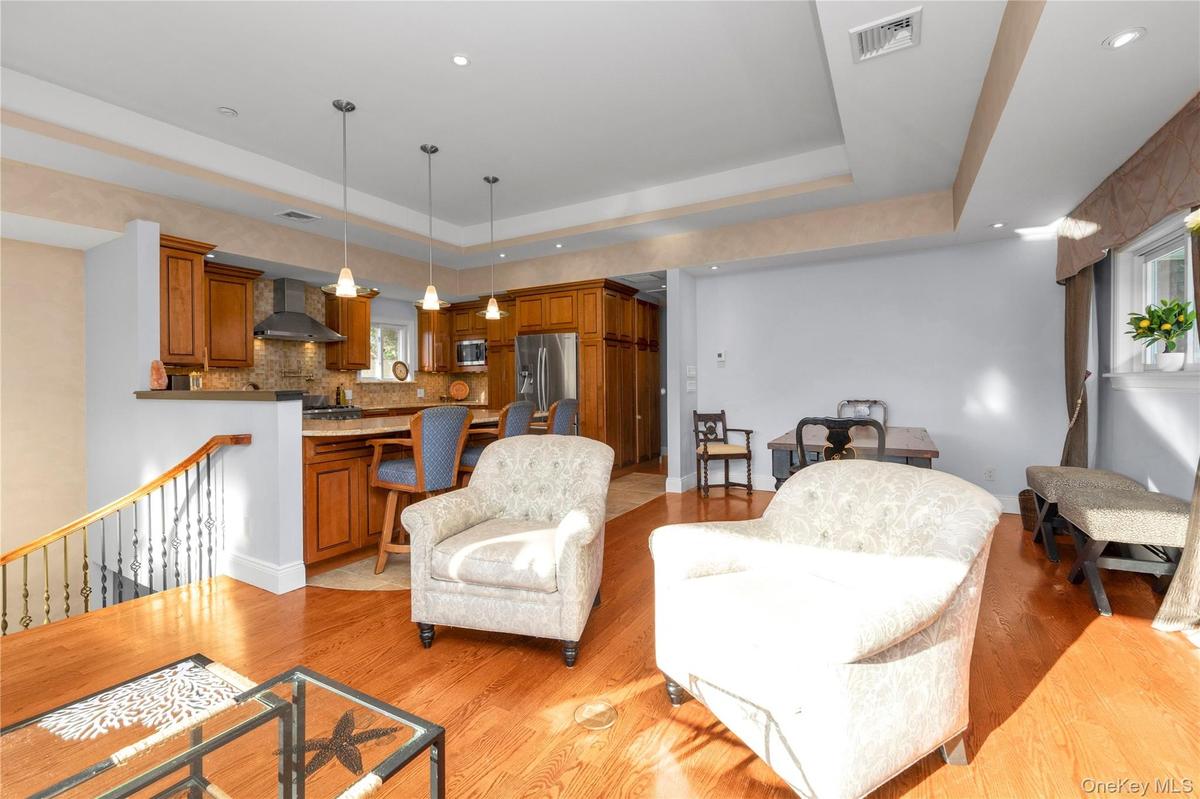 Front Living Room with open floorplan to Dining Room and Eat in Kitchen with Island