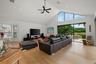 Vaulted ceiling with recessed lighting and a ceiling fan
