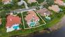 Mediterranean-style residence with a red tile roof and white exterior