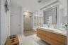 Dual vanity with a rectangular basin sink and a stone countertop