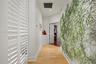 Hardwood flooring throughout, white plantation shutters, recessed lighting, and white trim