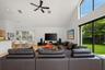 Vaulted ceiling with recessed lighting and ceiling fan