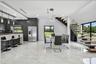Open-concept interior featuring large format marble-look tile flooring, a modern floating staircase with glass railing, a kitchen with dark cabinetry 