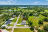Expansive surrounding green spaces, including Okeeheelee Golf Course and water features