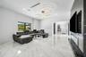 Polished tile flooring, recessed lighting, and contemporary ring chandeliers