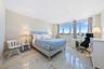 Expansive windows, high ceilings, and light-toned walls