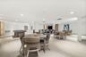 Spacious communal area featuring recessed lighting, light wood-finish flooring, a billiards table, and multiple seating areas