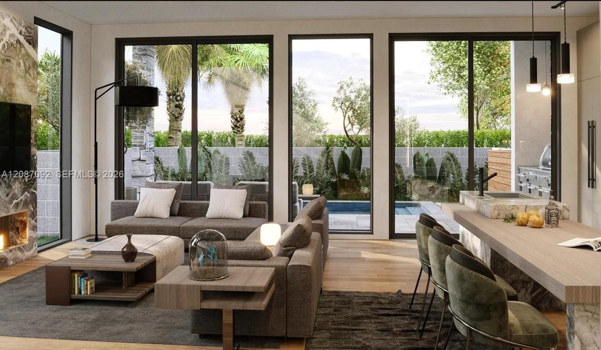 Open concept living area with wood-finish flooring