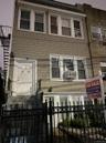 Legal four family property with four car garage serviced by public laneway