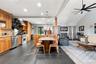 Gourmet kitchen with stainless steel appliances, granite counter and island