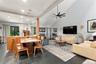 Vaulted ceiling with exposed beam and modern ceiling fan