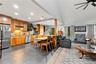 Open-concept living area with a kitchen, dining space, and living room