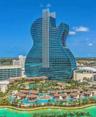 Unique guitar-shaped high-rise structure featuring a glass facade