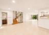 Recessed lighting, wood staircase, clear glass elevator, tiled flooring, and sliding glass doors
