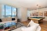 Floor-to-ceiling windows, wood-finish flooring, recessed lighting, and a built-in pool table