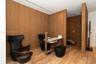 Wood-finish flooring with coordinating wood-paneled walls
