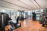 Fitness center with wood-finish flooring, recessed lighting, track lighting, and expansive window walls