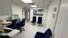 White tile flooring and white painted walls with recessed lighting