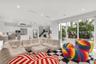 Open-concept living area with white walls and recessed lighting