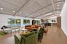 Vaulted wood-finish ceilings with recessed lighting, skylight, and wood-finish flooring