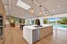 Vaulted wood-finish ceiling with exposed beams and skylight
