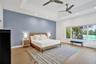 Tray ceiling with recessed lighting and two ceiling fans