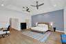 Tray ceiling with recessed lighting and two ceiling fans