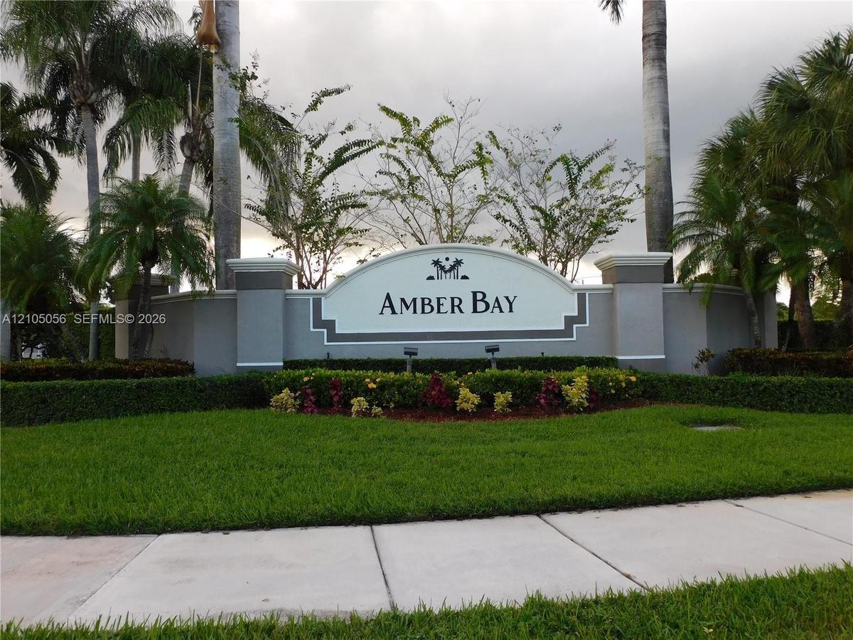 Community entrance sign featuring a curved top and integrated lighting