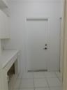 2nd Bathroom - ample countertop space, contemporary wall-mounted light fixtures, and mirrored medicine cabinets