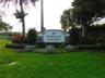 Emerald Estates at Weston signage featuring white columns and dark lettering