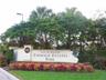 Second-level landing with carpet flooring, white painted walls, and track lighting - you can make it to suit your needs.
